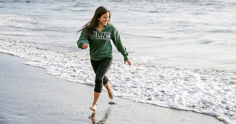 PLNU senior Katie Green runs on the beach.