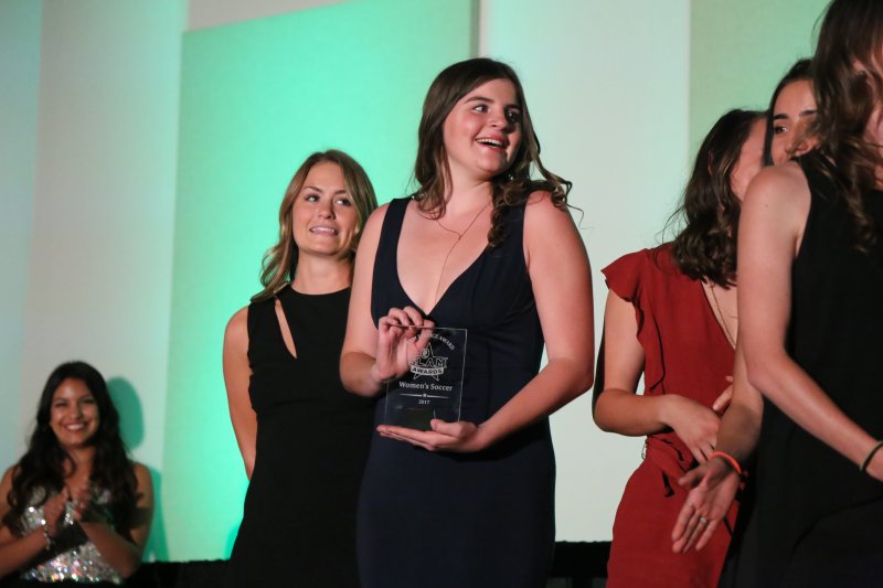 PLNU women's soccer team players receive their team award at the inaugural SLAM awards