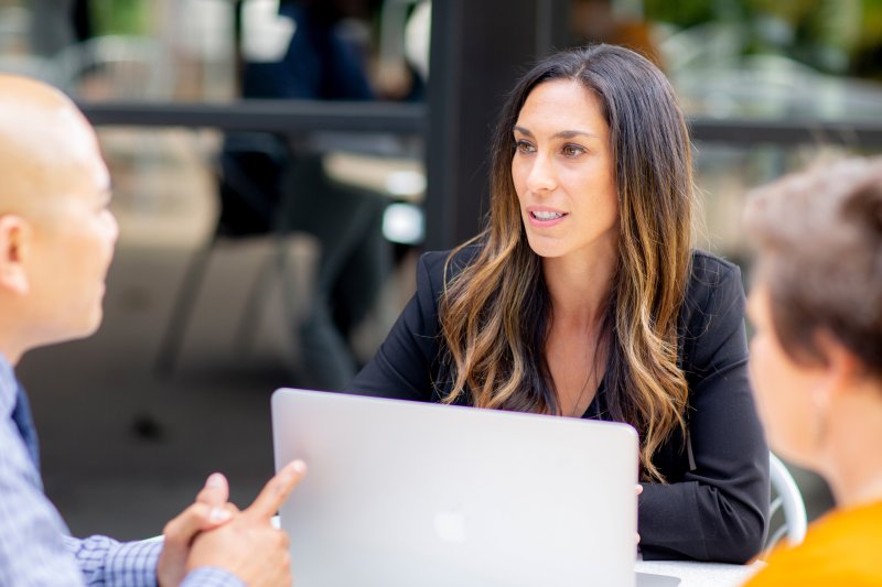 Female graduate student in small group
