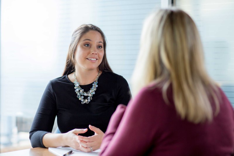 student talking to a client 