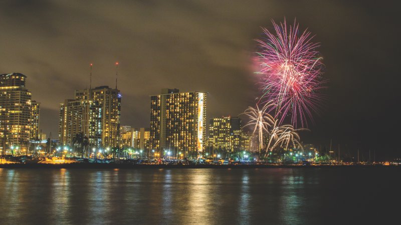 Hawaii Skyline with Red Fireworks in the sky.