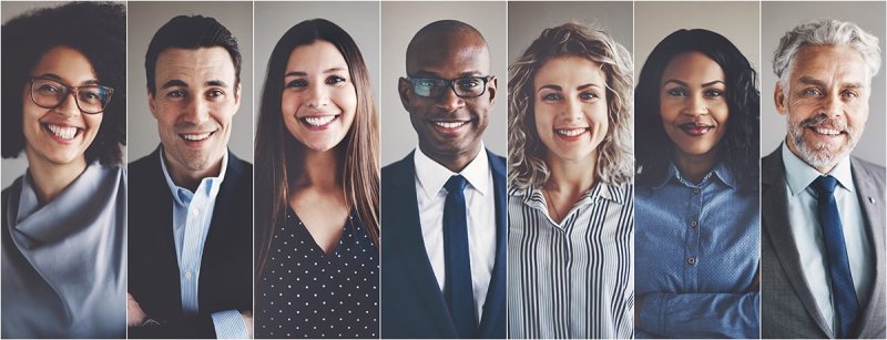 Smiling group of ethnically diverse businessmen and businesswomen