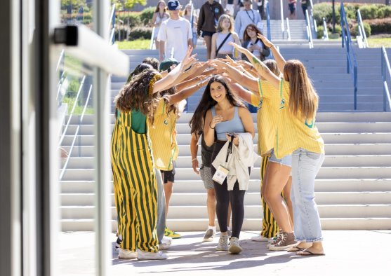 Students welcoming each other on campus