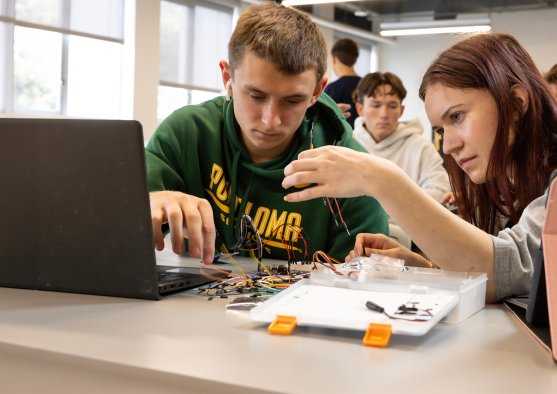 Two PLNU students working on class project together in the engineer lab.