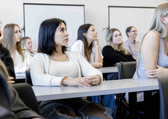 PLNU students listening attentively during a classroom lecture.