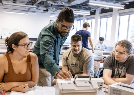 PLNU students work together on technical project in the engineering lab on the university campus.
