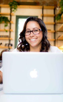 San Diego PLNU student takes class online in a coffee shop