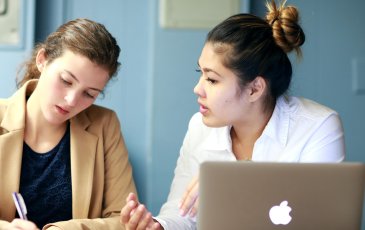 Two people at a computer 