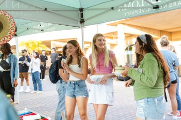 Students talking at the Club Fair. 