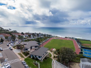 aerial photo of track and apartments 