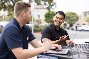 Military students sitting at a table in Liberty Station