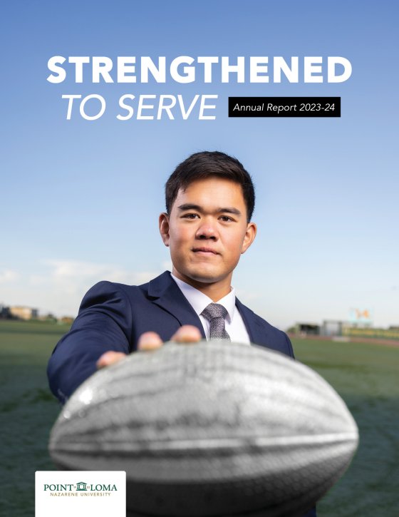 Annual Report cover 23/24 with student in suit holding a rugby ball